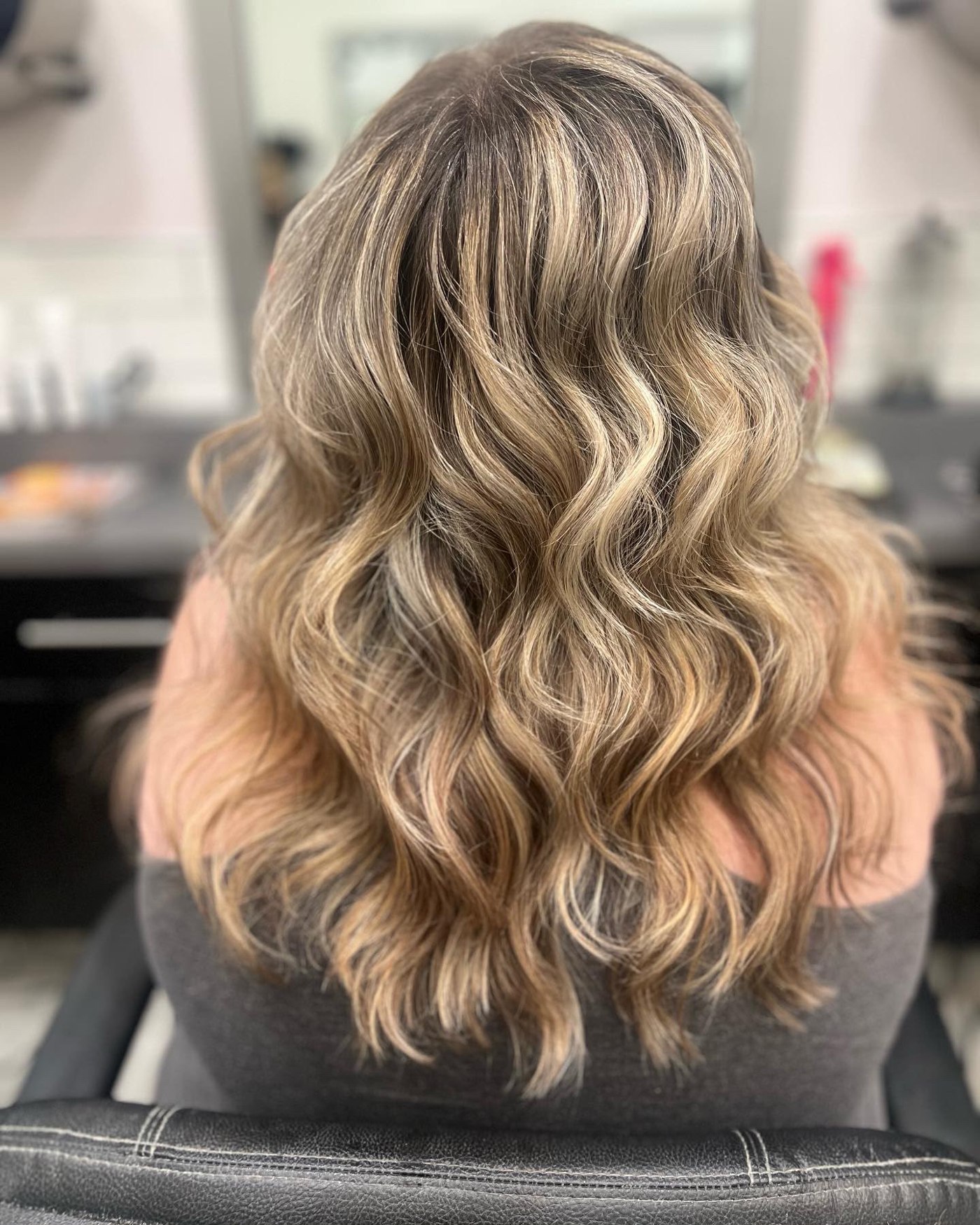 Blended blonde waves by Kelly May at Shear Bliss