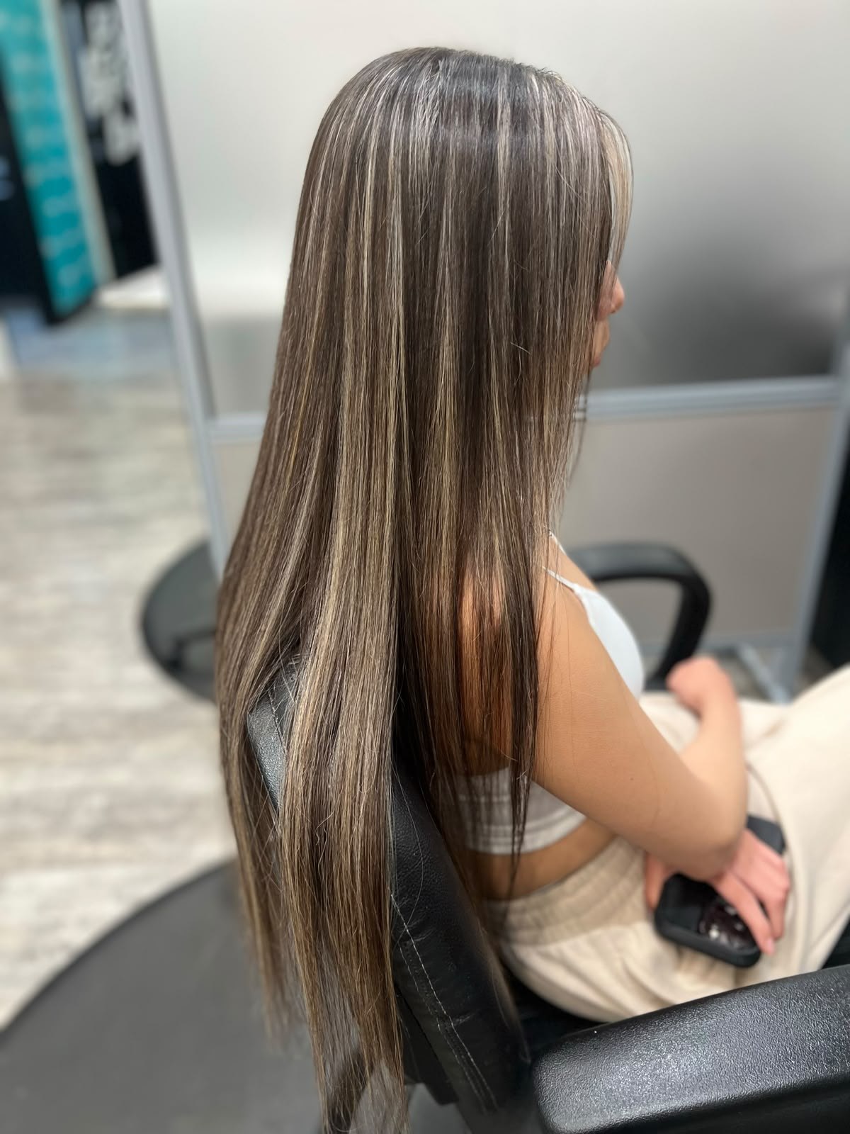 Long brunette highlights by Kelly May at Shear Bliss